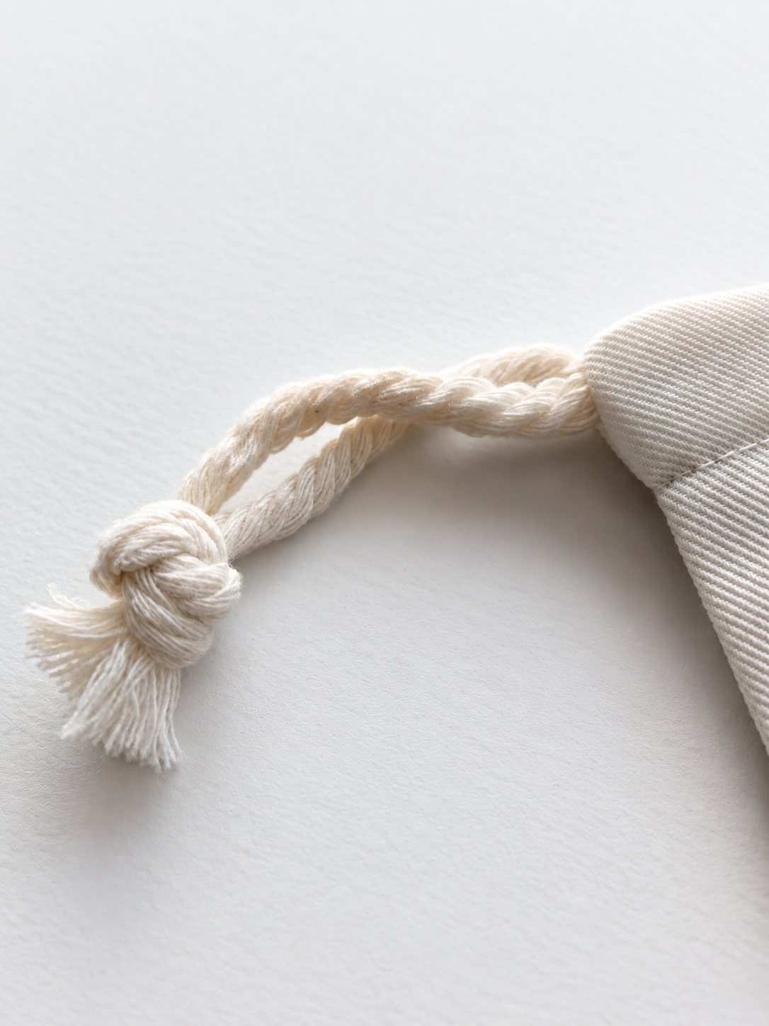 Close-up of pouch drawstring detail